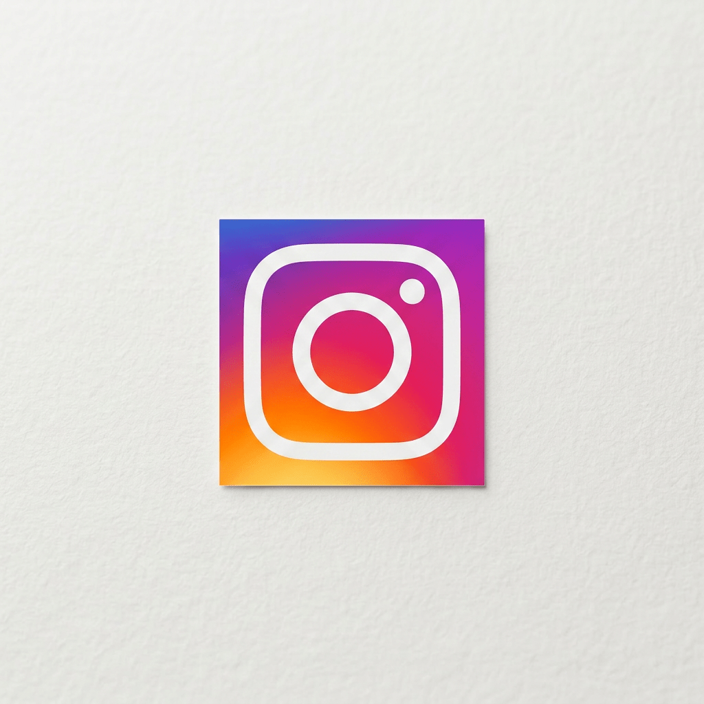 Gold Instagram logo on white textured background